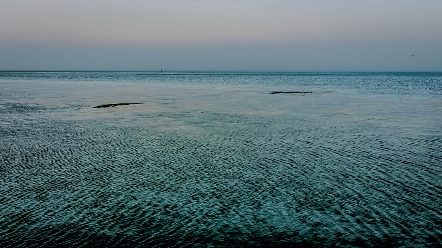 Calm Blue Sea Surface with Gentle Ripples at Dusk
