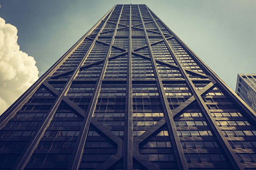 Low angle view of modern skyscraper with cross-bracing