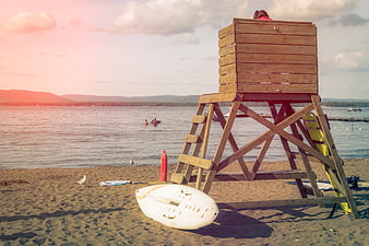 Wooden Lifeguard Tower on Sandy Beach with Rescue Equipment