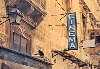 Vintage Cinema Sign on Old European Building Facade