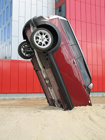 Red SUV Stuck Upside Down in Sand Dune