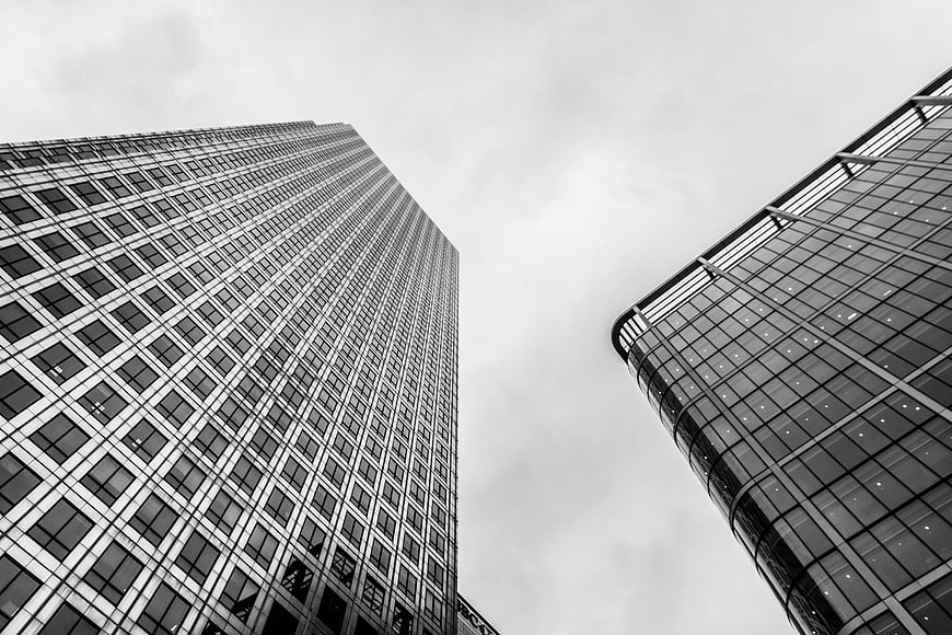 Black and white low angle view of modern skyscrapers