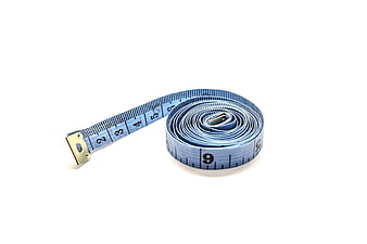 Blue Tailor's Measuring Tape Coiled On White Background