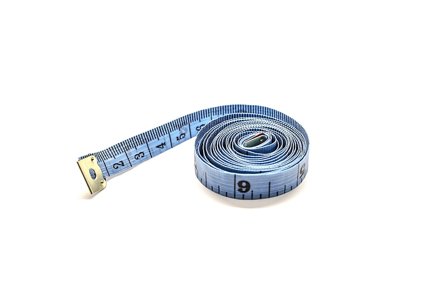 Blue Tailor's Measuring Tape Coiled On White Background