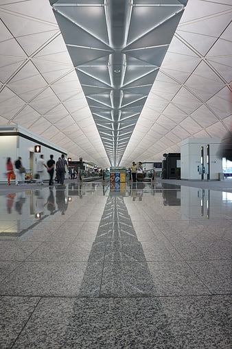 Modern Airport Terminal Interior With Geometric Ceiling And Polished Floor