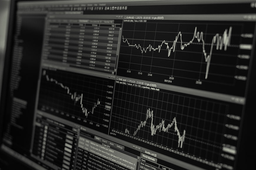Financial trading charts on computer monitor screen