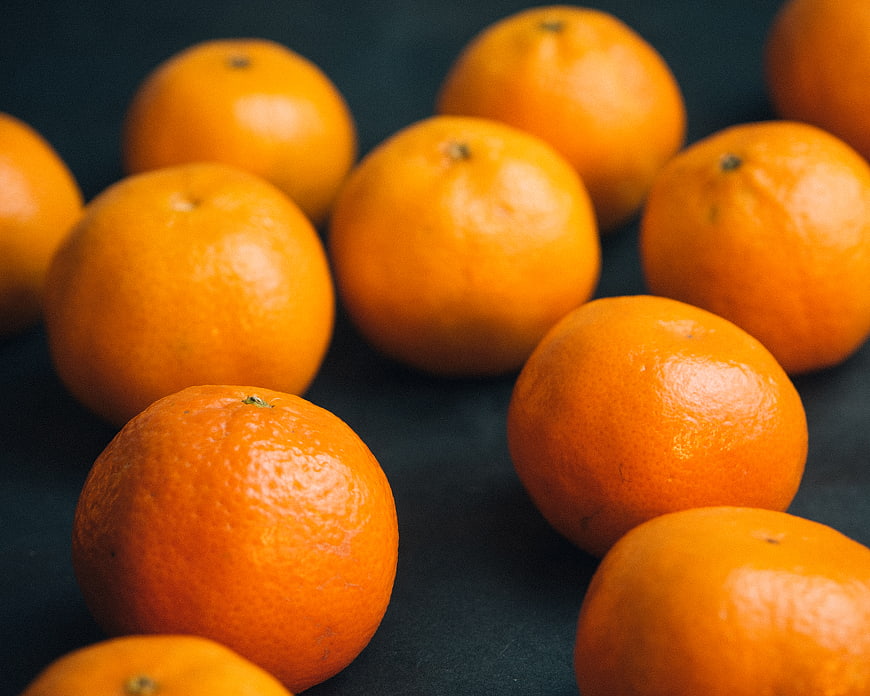 Fresh Oranges on Dark Background