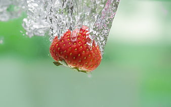 Fresh Strawberry Falling into Water Splash