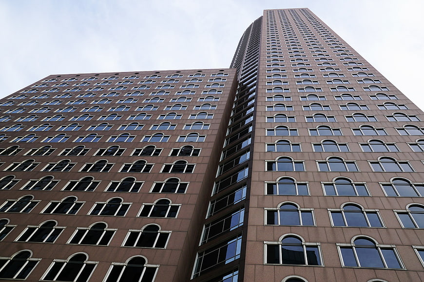Low angle view of brown brick skyscraper facade