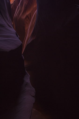 Dark Slot Canyon Interior with Smooth Sandstone Walls