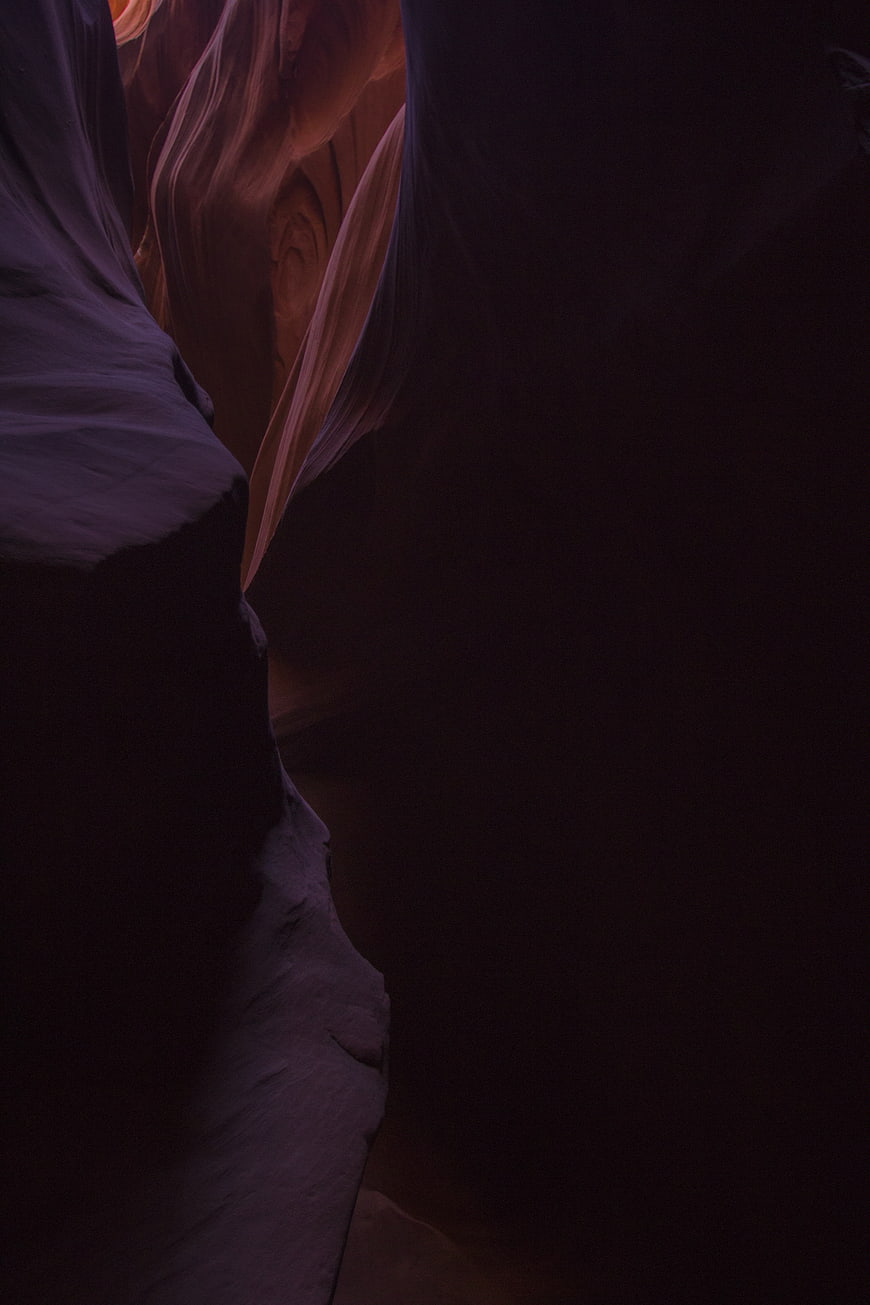 Dark Slot Canyon Interior with Smooth Sandstone Walls