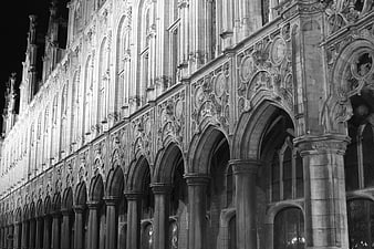 Black and white night photo of gothic cathedral arches