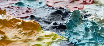 Abstract colorful paint texture close-up with vibrant ridges