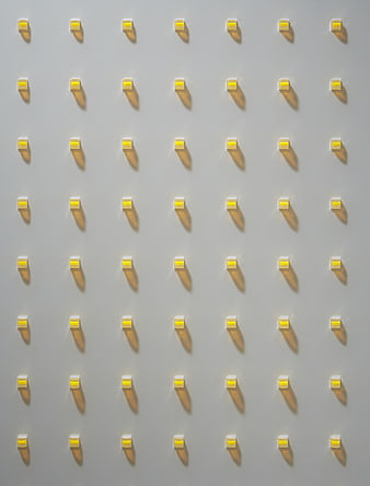 Grid of Yellow LED Lights on White Surface