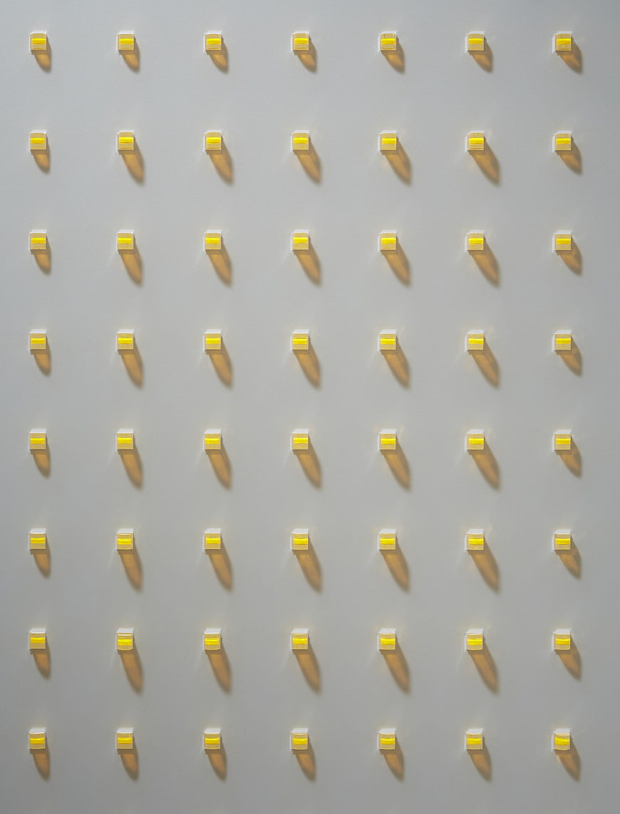 Grid of Yellow LED Lights on White Surface