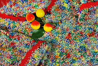 Colorful Knitted Sweater with Yellow and Red Brooch