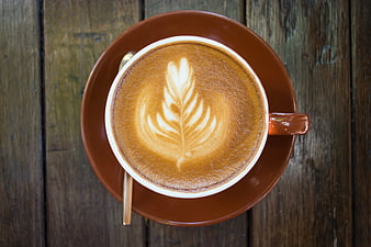 Top View of Latte Art on Rustic Wooden Table