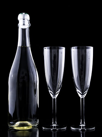 Champagne Bottle and Two Flutes on Black Background
