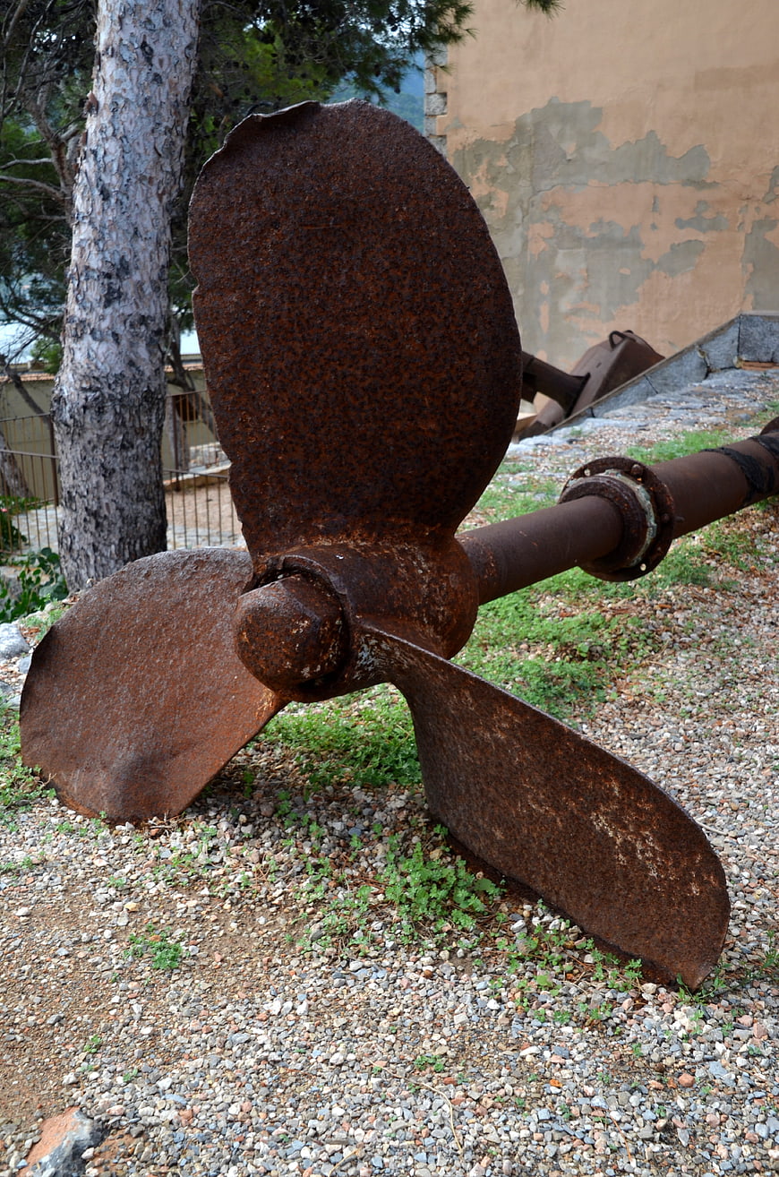 Rusty Ship Propeller on Gravel Ground