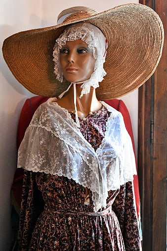 Vintage Mannequin in Floral Dress and Straw Hat