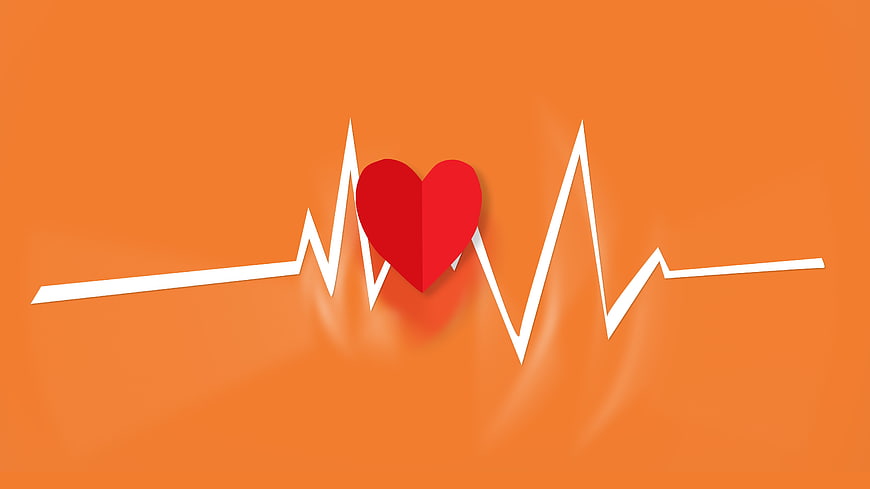 Red Paper Heart on Orange Background with ECG Pulse Line