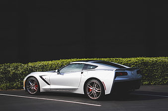 White Sports Car Parked on Asphalt Road