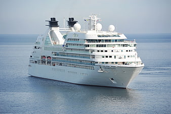 White Seabourn Quest Cruise Ship Sailing on Calm Blue Ocean
