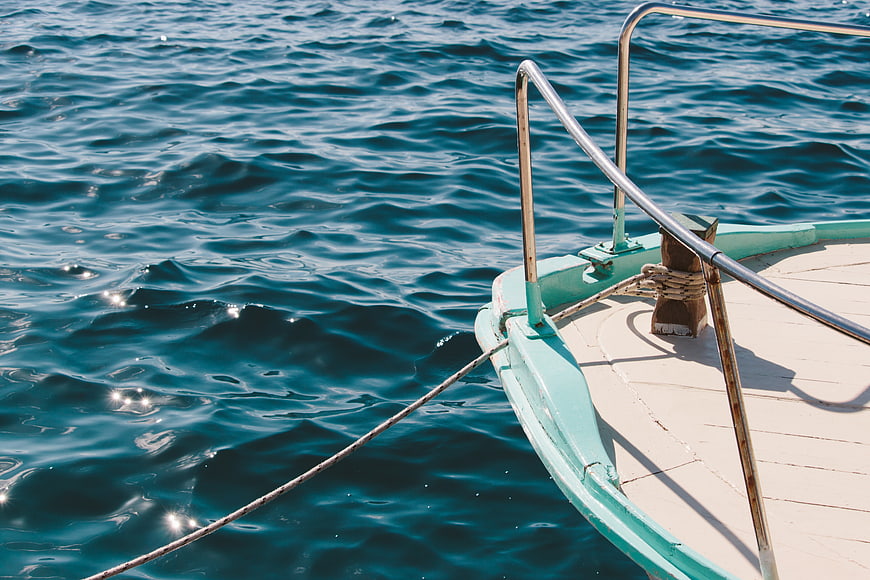 Close-up of boat bow on blue ocean water