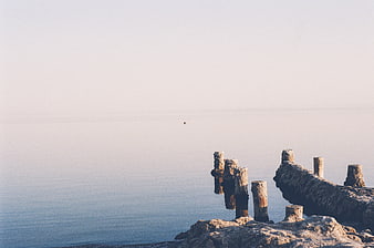 Minimalist Sea View with Old Wooden Piers and Calm Water