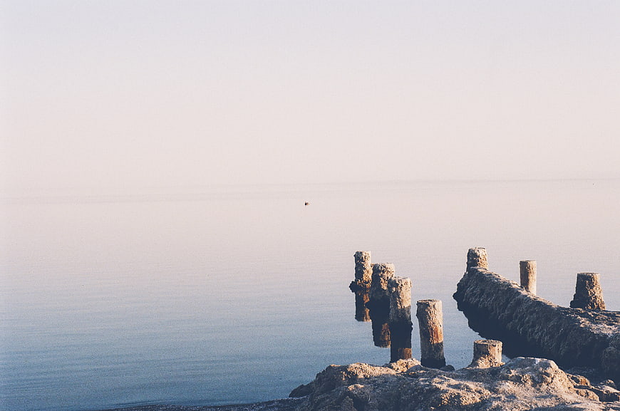 Minimalist Sea View with Old Wooden Piers and Calm Water