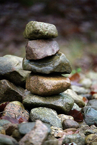 Stacked river stones in a forest setting