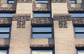 Ornate Brick Building Facade with Stone Reliefs