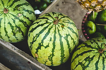 Fresh Watermelons and Pineapple at a Fruit Market