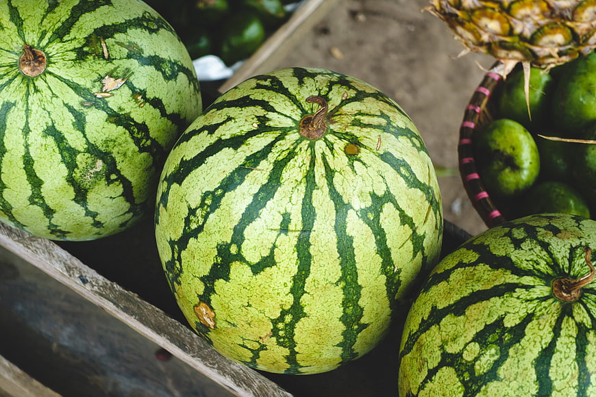 Fresh Watermelons and Pineapple at a Fruit Market