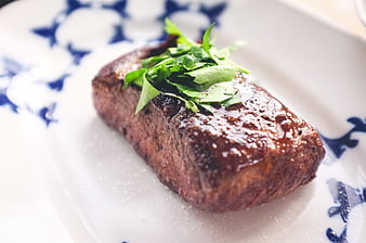 Grilled Beef Steak with Fresh Herbs on Decorative Plate