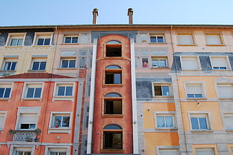 Colorful European Apartment Building Facade with Arched Windows