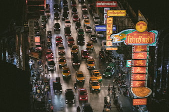 High angle night view of busy Bangkok Chinatown traffic
