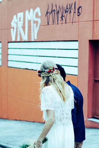 Couple Walking Away in Urban Setting with Graffiti Background