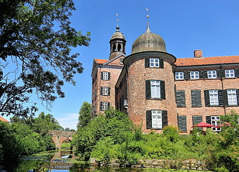 Historic Brick Castle With Dome And Moat In Germany