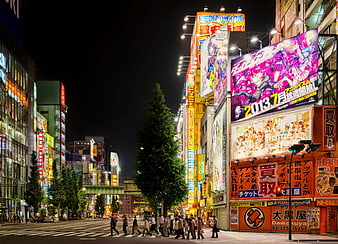 Vibrant Tokyo Night Street Scene With Neon Signs And Pedestrians