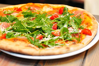 Fresh Pizza with Arugula, Tomatoes, and Prosciutto