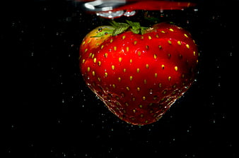 Fresh Strawberry Submerged in Water with Bubbles