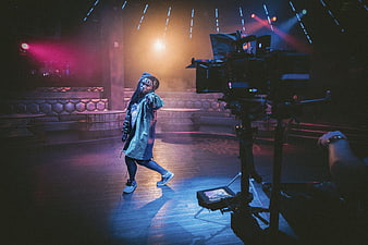 Dancer performing on stage during video production shoot