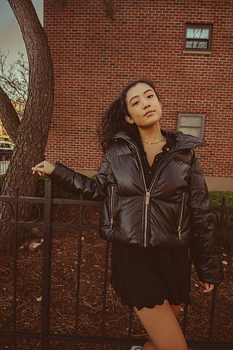 Stylish Asian Woman in Black Puffer Jacket Urban Portrait