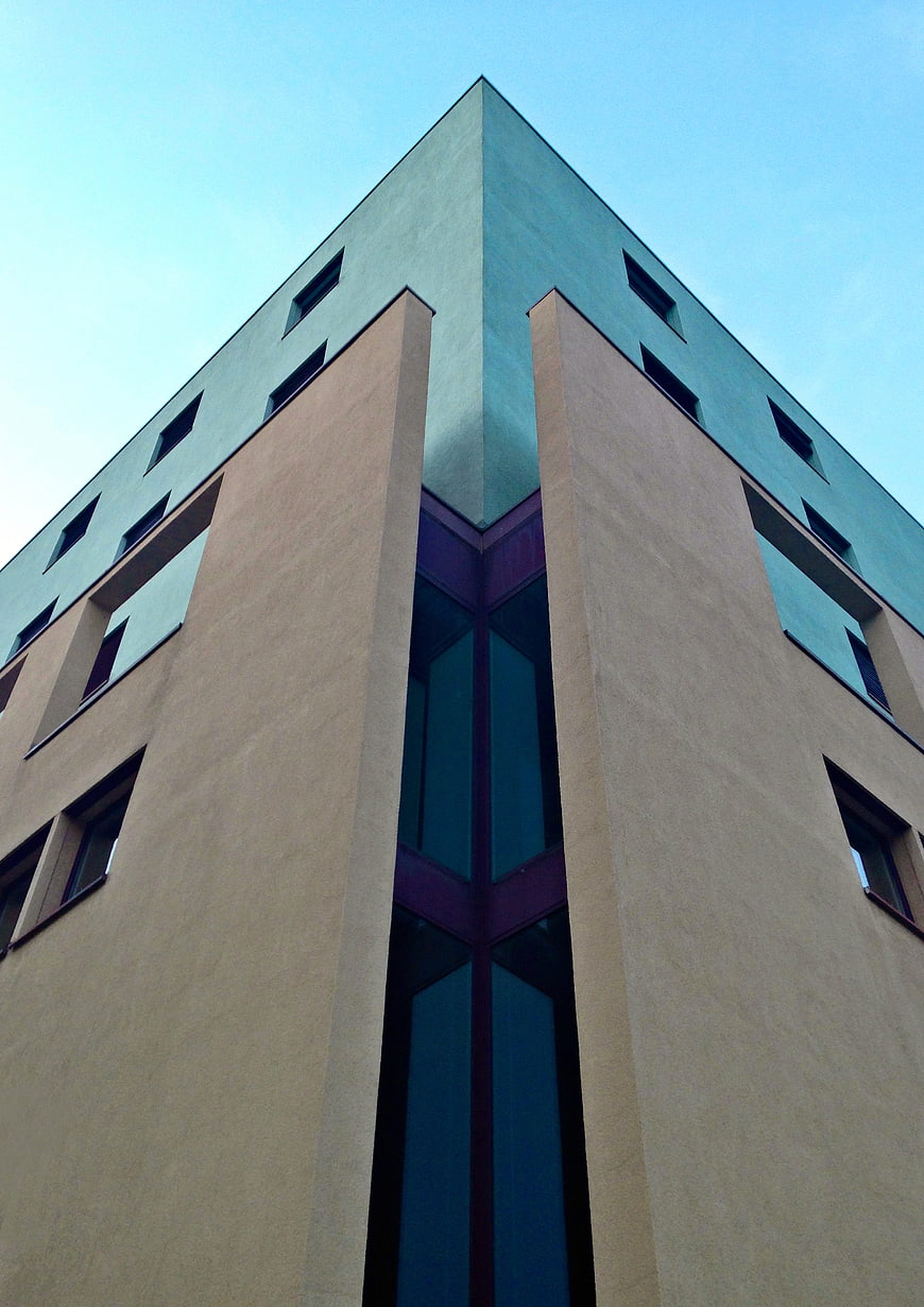 Low angle view of modern building facade with geometric windows