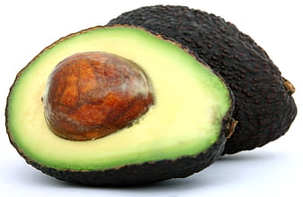Fresh Halved Avocado with Pit on White Background