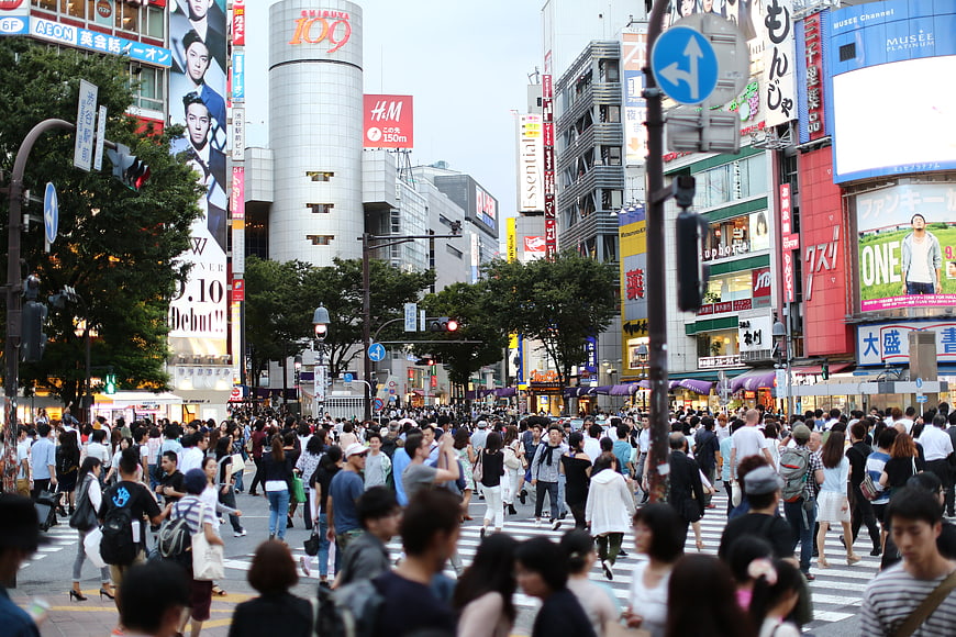 Crowded Shibuya Crossing Street Scene In Tokyo Japan
