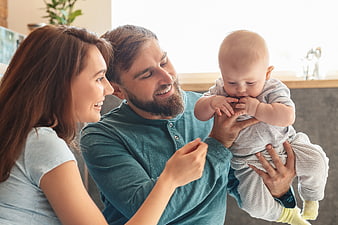 Happy Family with Baby at Home