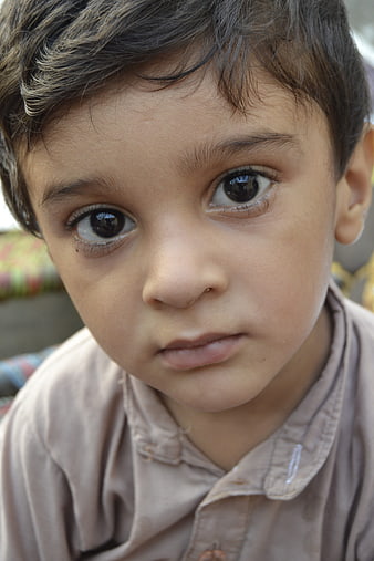 Close-up portrait of a young boy with expressive eyes