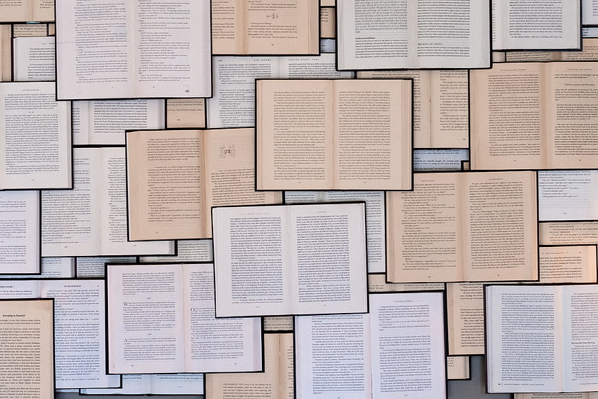 Collage of Open Books with Text Pages Background
